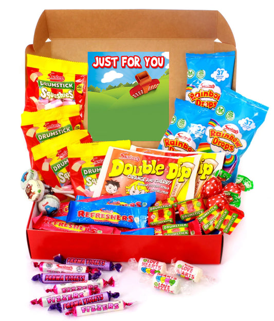A candy and snack gift box filled with assorted packaged sweets and lollipops, including Rainba Drops, Drumstick, Double Dip, and Refreshments, arranged in an open brown cardboard box with a 'Just For You' card, on a white background.