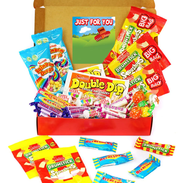 A curated candy gift box filled with assorted branded sweets and wrapped candies, shown open on a white background. Visible brands include Double Dip, Drumstick, Big Bag, and Snickersaas.