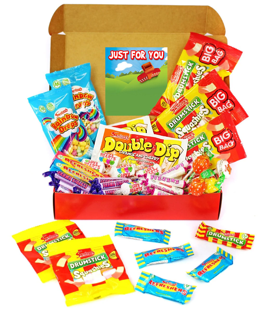 A curated candy gift box filled with assorted branded sweets and wrapped candies, shown open on a white background. Visible brands include Double Dip, Drumstick, Big Bag, and Snickersaas.