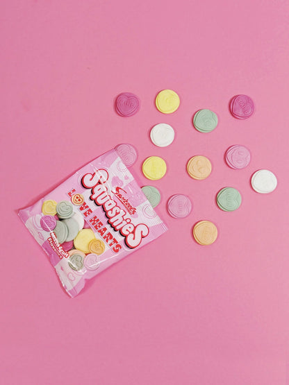 Pack of Ferrero Rocher hearts on a pink background