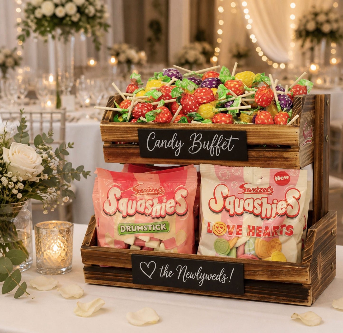 Candy buffet with 'Squashies' and 'Love Hearts' on a decorated table.